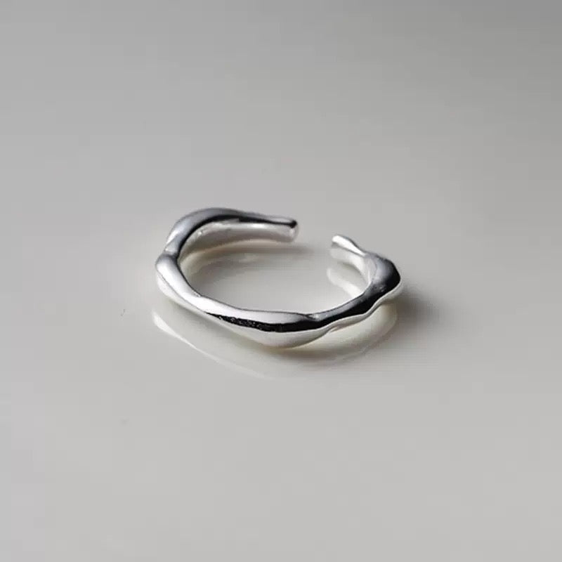 clsoe up of hand-filed edges on irregular silver ring