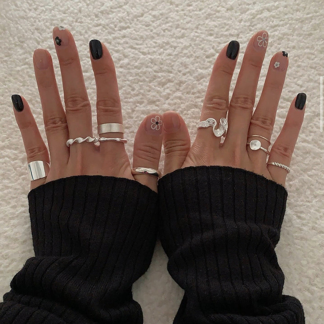 Stacked brushed concave rings with other minimalist silver jewelry - versatile unisex styling